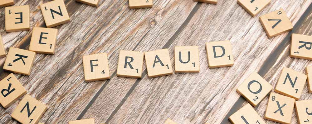 Identity theft blog image, with letters forming the word fraud from pexels user Markus Winkler